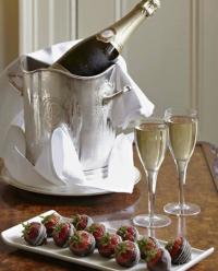 chocolate-covered strawberries, a bottle of sparkling wine